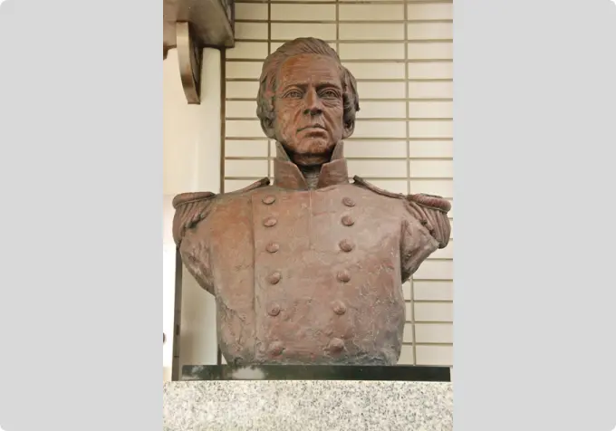 A bronze bust of U.S. Commodore Matthew Perry wearing a naval uniform.