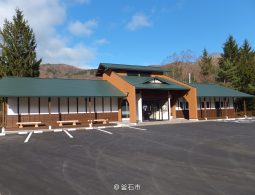 Hashino Iron Mining Information Center building with a parking lot in front.