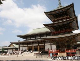 The temple's Three-Story Pagoda (Sanju no To) in the foreground with the large Great Main Hall in the background.