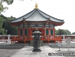 The Komyodo Hall, a brightly painted building with a central stone lantern.