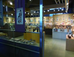 The interior of the museum gift shop, displaying ukiyo-e prints, fans, and merchandise.