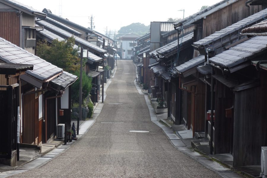 A long, quiet street lined with traditional wooden houses and tiled roofs in Seki-juku post town.
