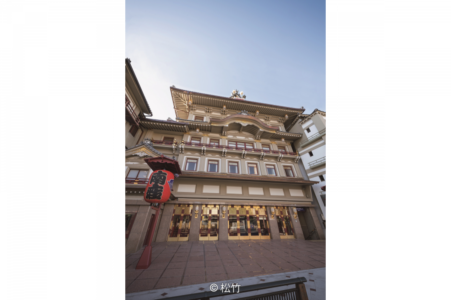 The main facade of the Minamiza Kabuki Theatre, featuring Momoyama-style architecture and a large red lantern (chochin) in the foreground.