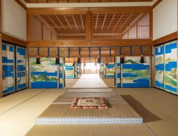 Kogosho (Small Palace) at the Kyoto Imperial Palace. This building was used for ceremonies and meetings with the Shogun and Daimyo. It is famously known as the site of the "Conference of Kogosho" (Kogosho Kaigi) in 1868, which determined the restoration of Imperial rule. The interior features sliding doors (fusuma) painted with landscapes using a distinctive blue mist technique called "Konjo-biki," creating a solemn yet vibrant atmosphere.