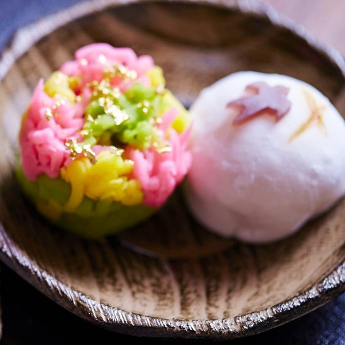 Colorful Japanese wagashi (sweets) on a plate.
