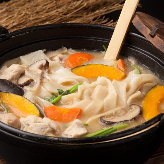 Hoto (flat udon noodles and vegetables) in a hot pot.